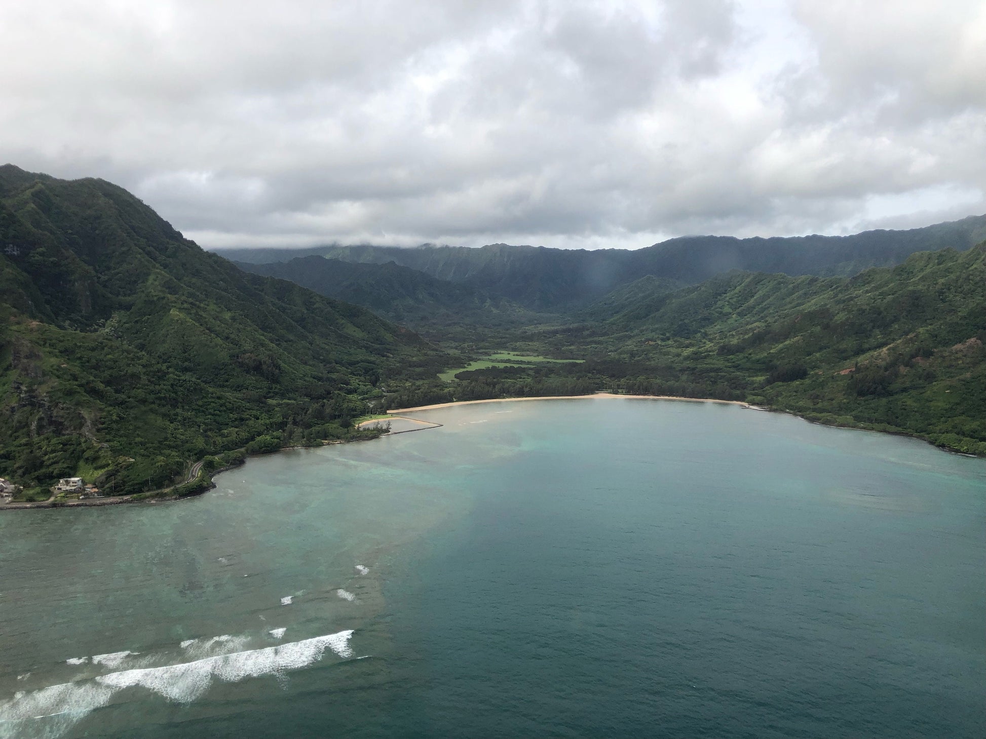 Picture of the ocean surrounded by the mountains in Hawaii. Would look great in any room. Also great for creators and their projects.